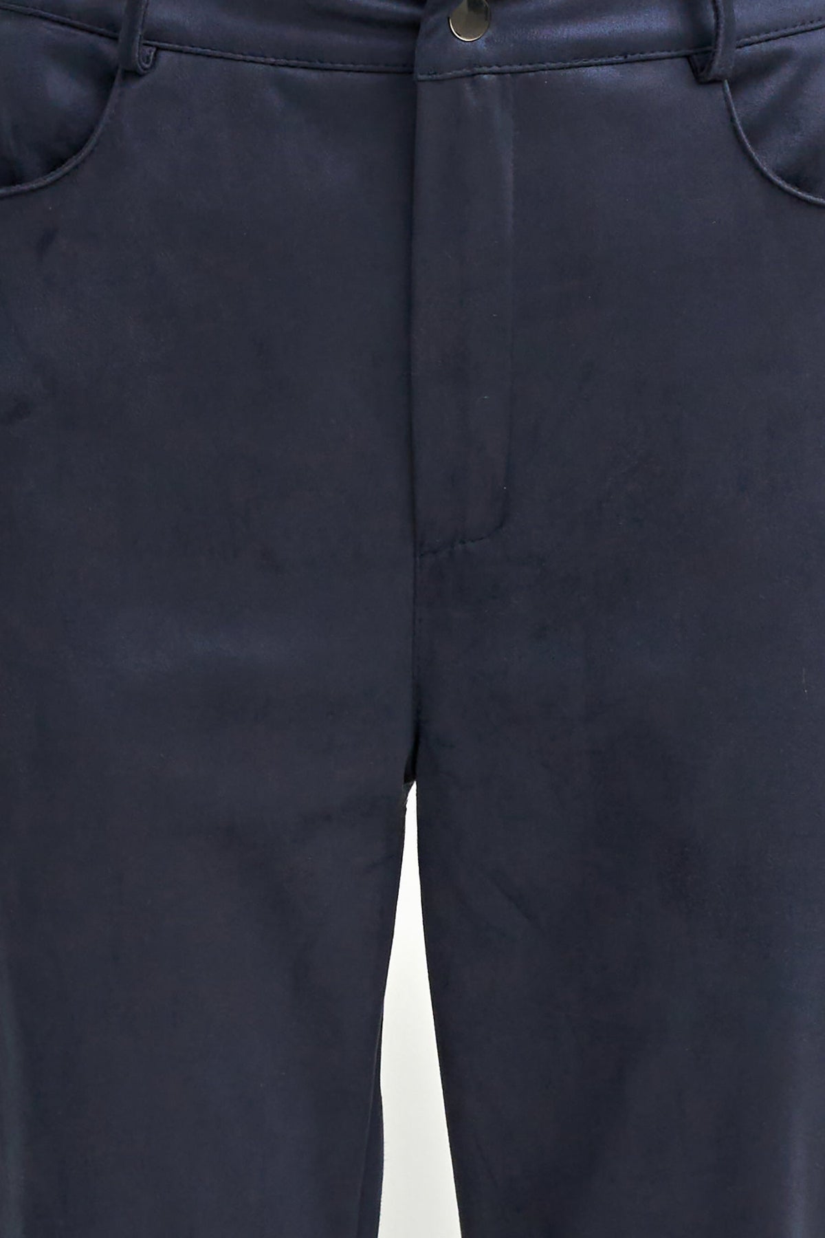 Close-up of dark navy trousers showing the front waistband, belt loops, button closure, and side pocket edges.