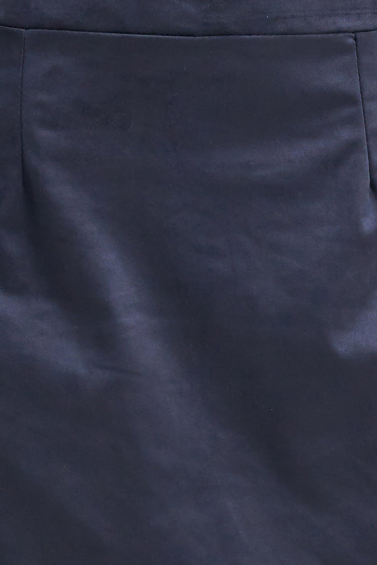 Close-up of a dark navy blue fabric surface with a subtle sheen and soft folds.