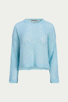 A light blue long-sleeve knit sweater with an intricate lace pattern, presented on a neutral light gray background.